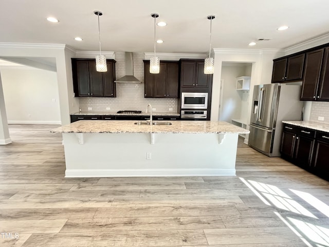 8813 Moss Glen Dr, Raleigh, NC 27617 - kitchen featuring wall chimney exhaust hood, stainless steel appliances, a sink, crown molding, and backsplash