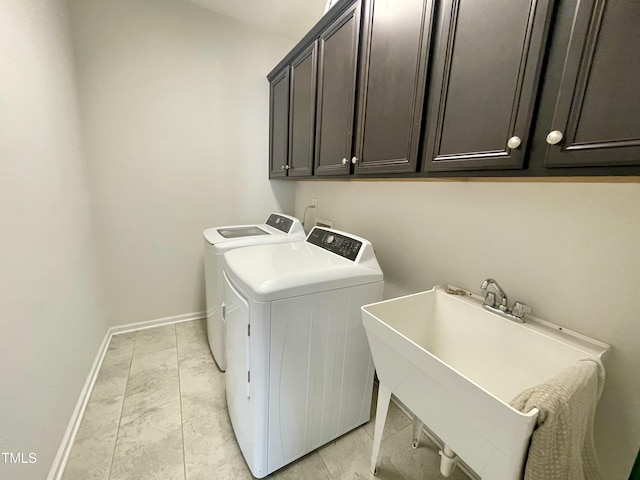 8813 Moss Glen Dr, Raleigh, NC 27617 - laundry room with washing machine and clothes dryer, cabinet space, and baseboards