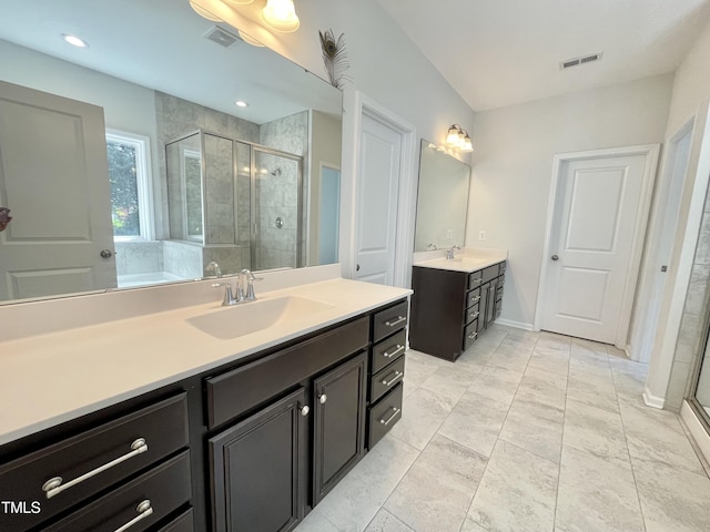 8813 Moss Glen Dr, Raleigh, NC 27617 - full bathroom with a shower stall, two vanities, and baseboards