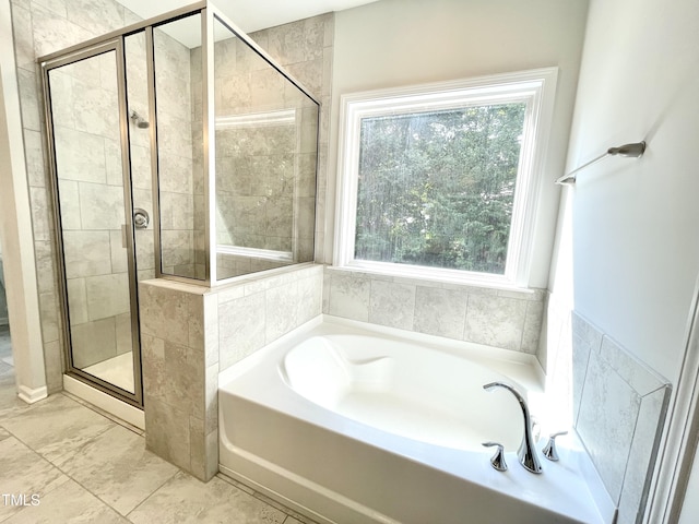 8813 Moss Glen Dr, Raleigh, NC 27617 - bathroom with a bath, a stall shower, and marble look tiles