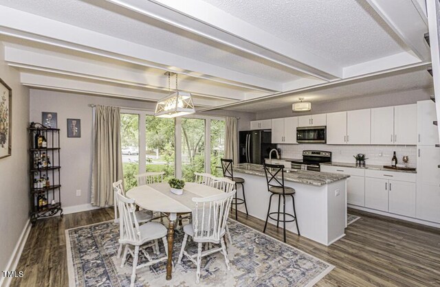 105 Litchfield Ct, Rocky Mount, NC 27803 - dining area featuring baseboards, dark wood-type flooring, beamed ceiling, and a textured ceiling