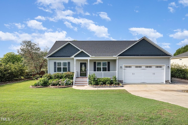 view of front of home featuring driveway, a porch, a garage, and a front yard