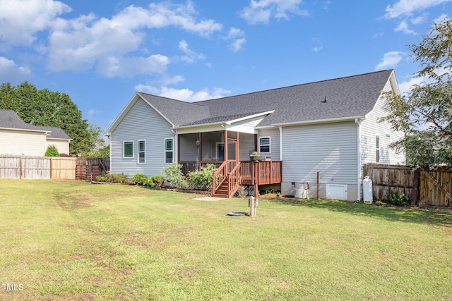 back of house with a deck, a shingled roof, and stairway