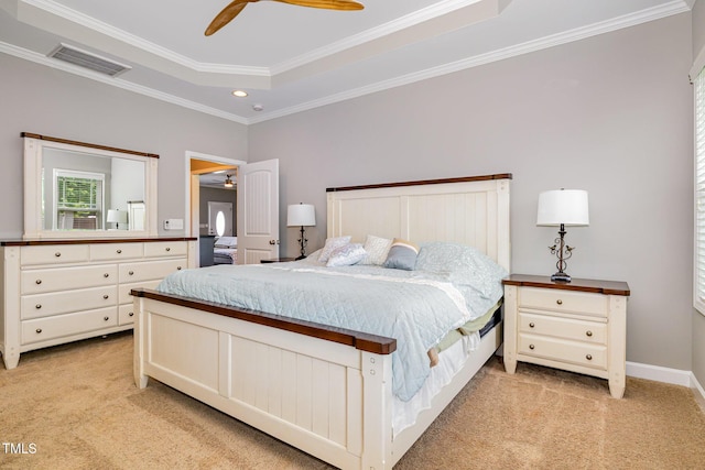 bedroom with light carpet, crown molding, recessed lighting, ceiling fan, and a tray ceiling