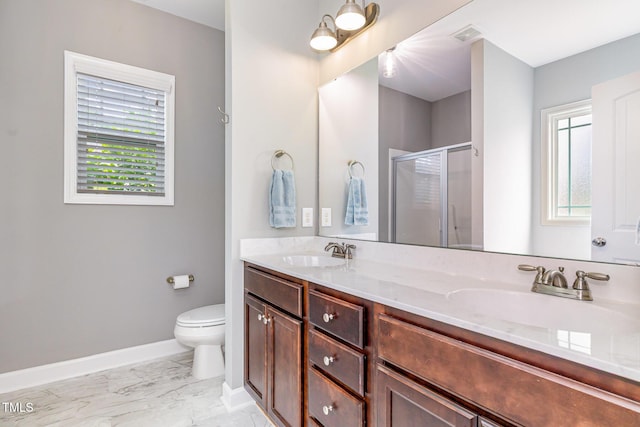 full bathroom with a stall shower, marble finish floors, baseboards, toilet, and double vanity