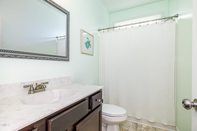 bathroom with toilet and vanity