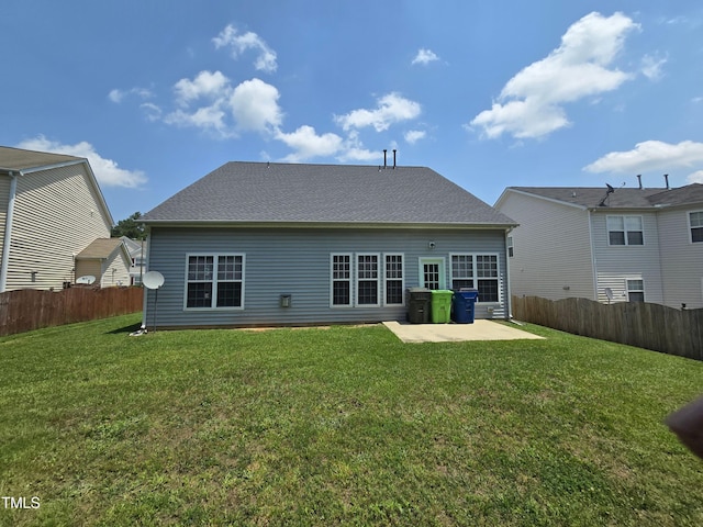 back of property with a patio