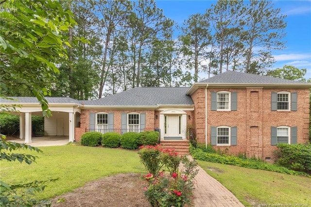 503 Charleston Pl, Fayetteville, NC 28303 - view of front facade featuring brick siding, a front lawn, and a carport