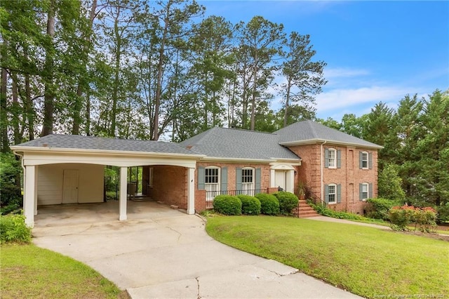 503 Charleston Pl, Fayetteville, NC 28303 - view of front of home with a front yard, driveway, brick siding, and an attached carport