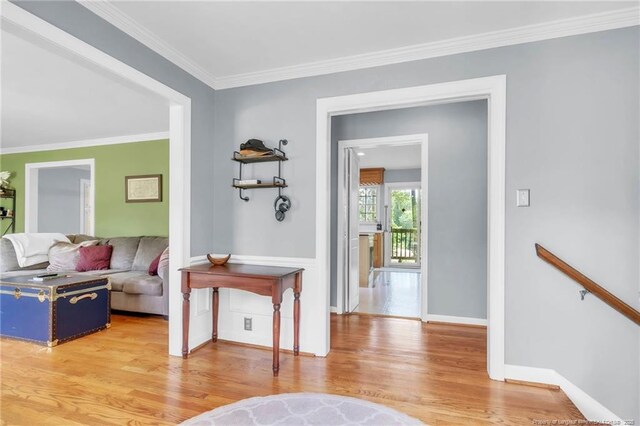 503 Charleston Pl, Fayetteville, NC 28303 - living area with light wood-style floors, ornamental molding, and baseboards