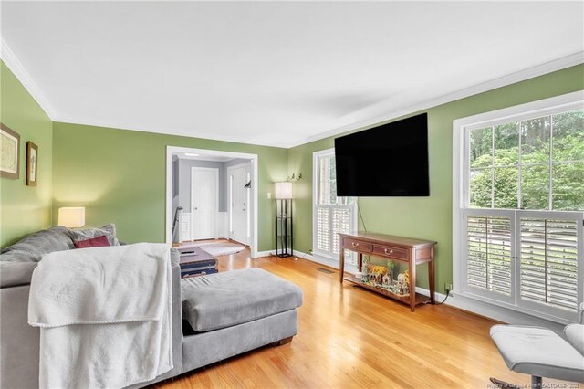 503 Charleston Pl, Fayetteville, NC 28303 - living area featuring ornamental molding, baseboards, and wood finished floors