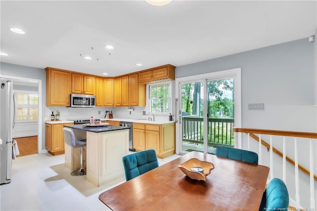 503 Charleston Pl, Fayetteville, NC 28303 - kitchen featuring stainless steel appliances, plenty of natural light, a center island, recessed lighting, and a breakfast bar