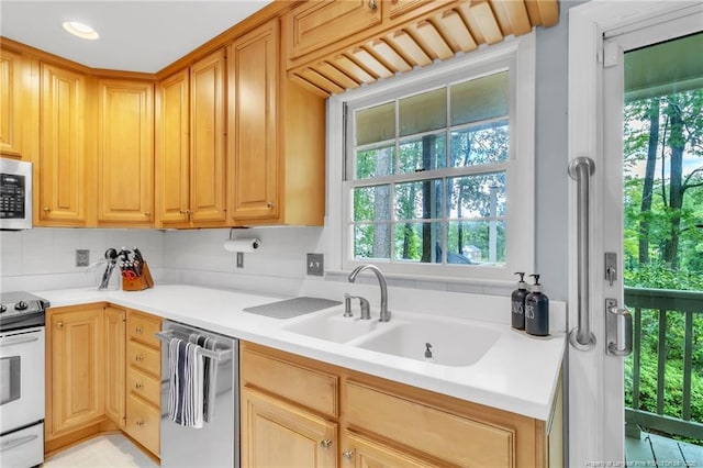 503 Charleston Pl, Fayetteville, NC 28303 - kitchen with white appliances, light countertops, a sink, decorative backsplash, and light brown cabinets
