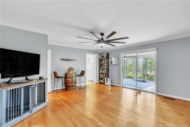 503 Charleston Pl, Fayetteville, NC 28303 - living room featuring crown molding, ceiling fan, wood finished floors, and baseboards