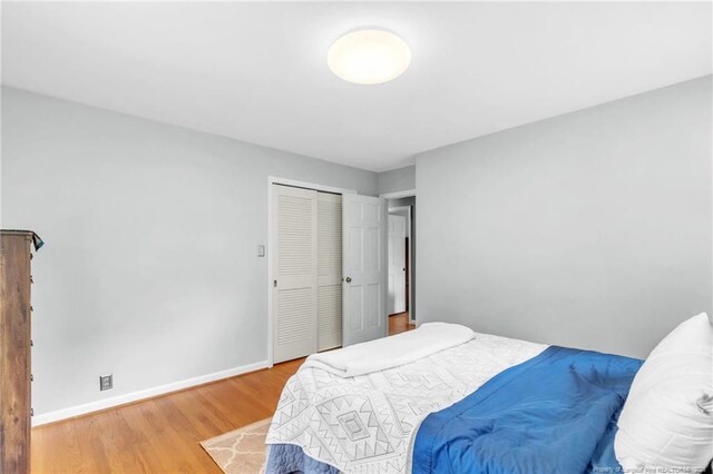 503 Charleston Pl, Fayetteville, NC 28303 - bedroom featuring wood finished floors, baseboards, and a closet