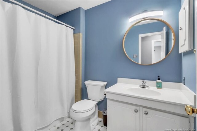 503 Charleston Pl, Fayetteville, NC 28303 - full bathroom with toilet, vanity, a shower with curtain, and baseboards