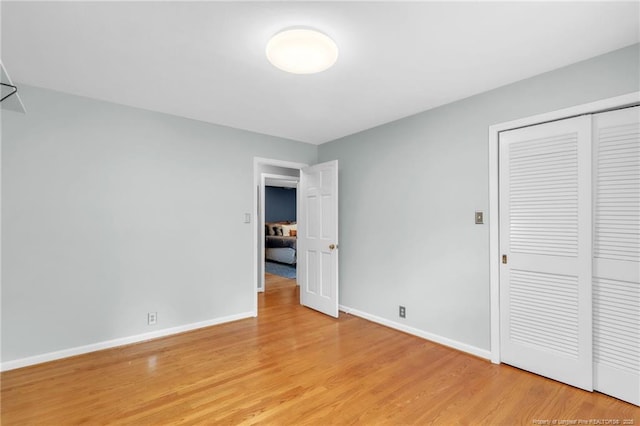 503 Charleston Pl, Fayetteville, NC 28303 - unfurnished bedroom featuring light wood-style floors, baseboards, and a closet