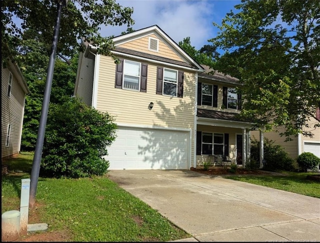 traditional home featuring a garage, concrete driveway, a porch, and a front yard