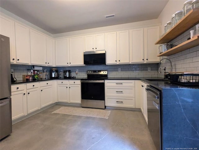 kitchen featuring appliances with stainless steel finishes, open shelves, a sink, finished concrete flooring, and decorative backsplash