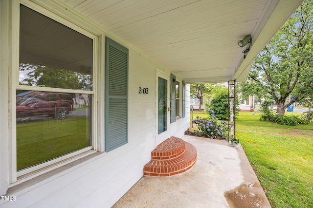 303 N Watauga Ave, Dunn, NC 28334 - covered porch featuring a yard