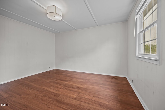 303 N Watauga Ave, Dunn, NC 28334 - empty room featuring wood finished floors and baseboards