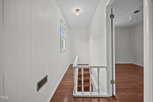 303 N Watauga Ave, Dunn, NC 28334 - corridor with wood finished floors, baseboards, and crown molding