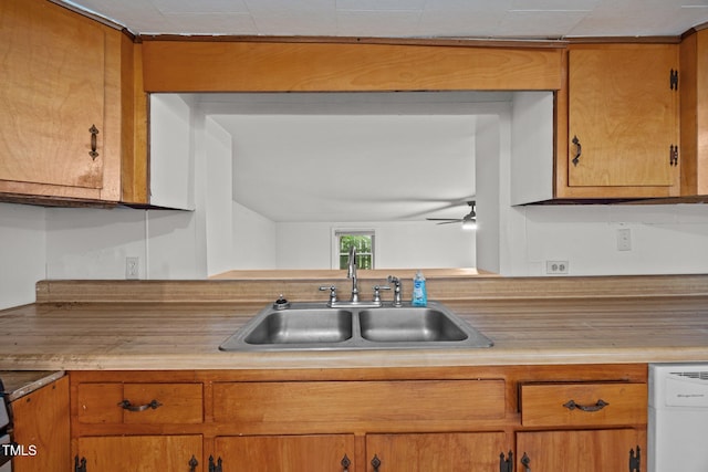 303 N Watauga Ave, Dunn, NC 28334 - kitchen with a sink, light countertops, ceiling fan, and white dishwasher