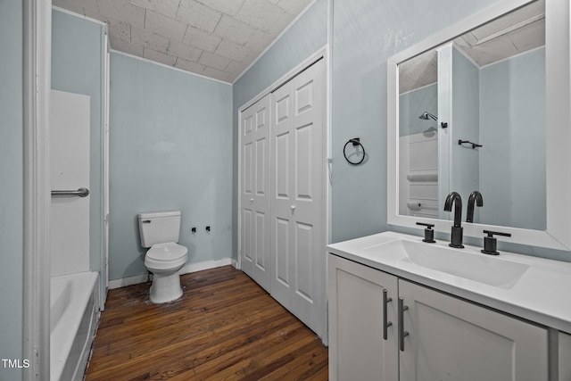 303 N Watauga Ave, Dunn, NC 28334 - full bath with vanity, wood-type flooring, and toilet