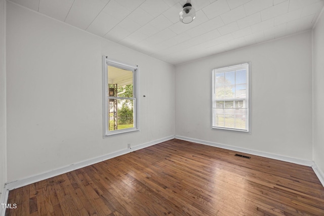 303 N Watauga Ave, Dunn, NC 28334 - empty room featuring hardwood / wood-style floors and baseboards