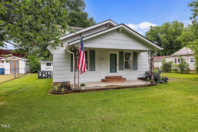303 N Watauga Ave, Dunn, NC 28334 - bungalow-style house with a porch