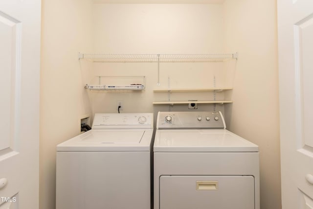 laundry room featuring washer and clothes dryer