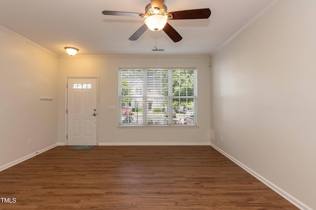 entryway with crown molding, wood finished floors, ceiling fan, and baseboards