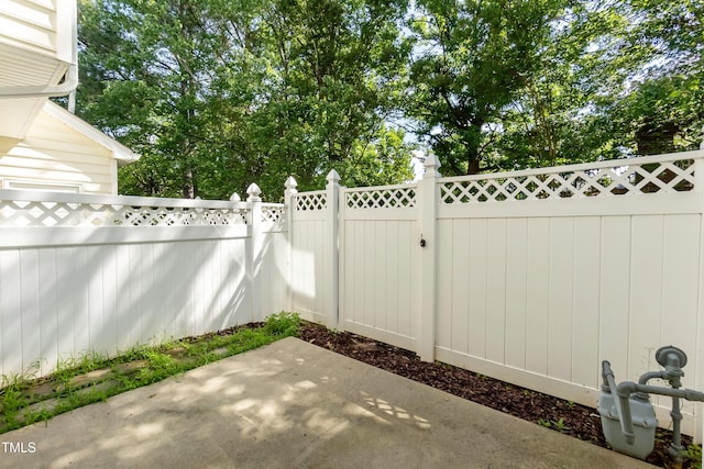 view of patio / terrace featuring fence