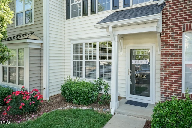 property entrance with brick siding