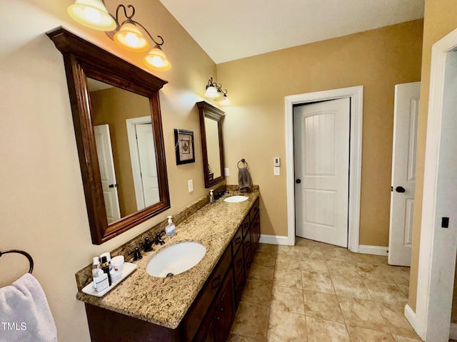 327 Beavertail Rd, Henderson, NC 27537 - bathroom with baseboards, double vanity, and tile patterned flooring