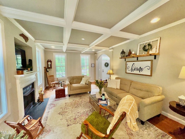 327 Beavertail Rd, Henderson, NC 27537 - living room featuring baseboards, wood finished floors, beamed ceiling, arched walkways, and coffered ceiling