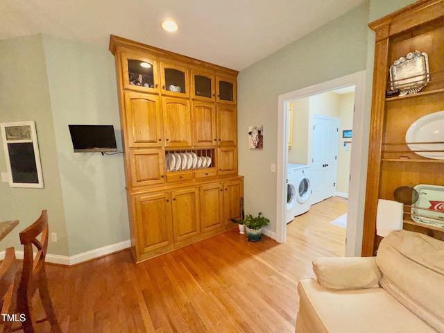 327 Beavertail Rd, Henderson, NC 27537 - living room with light wood finished floors, baseboards, washer and clothes dryer, and recessed lighting