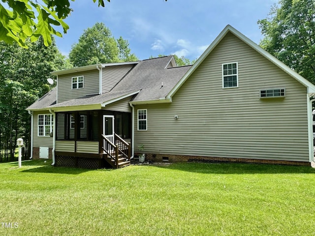 327 Beavertail Rd, Henderson, NC 27537 - back of house with crawl space, a sunroom, a yard, and a shingled roof