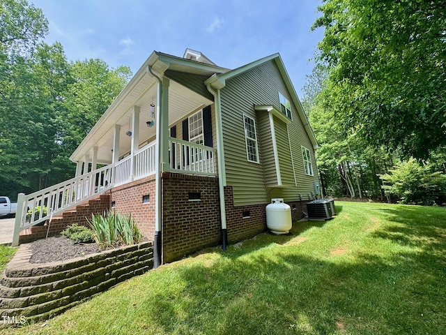 327 Beavertail Rd, Henderson, NC 27537 - view of side of property featuring crawl space, central AC unit, a yard, and stairway