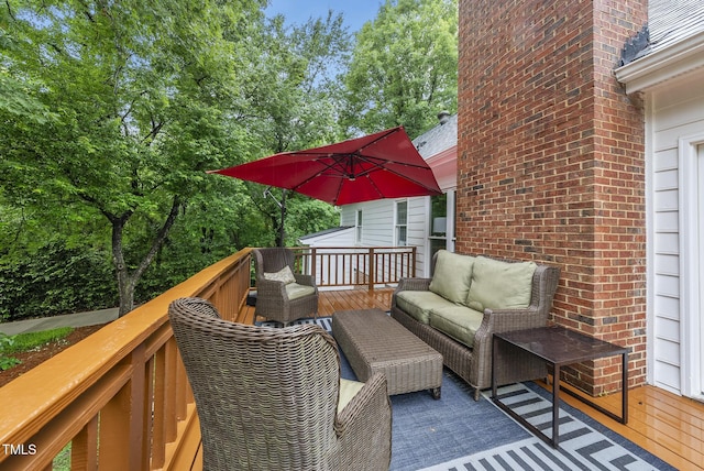 wooden terrace featuring an outdoor living space