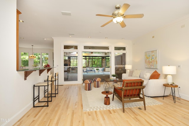 107 Silo Dr, Chapel Hill, NC 27514 - living area with light wood-type flooring, baseboards, crown molding, and a ceiling fan