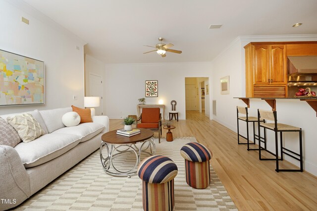 107 Silo Dr, Chapel Hill, NC 27514 - living room featuring a ceiling fan, light wood-style floors, ornamental molding, and baseboards