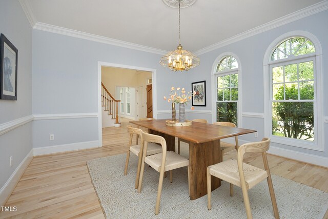 107 Silo Dr, Chapel Hill, NC 27514 - dining area featuring light wood-type flooring, a chandelier, ornamental molding, stairway, and baseboards
