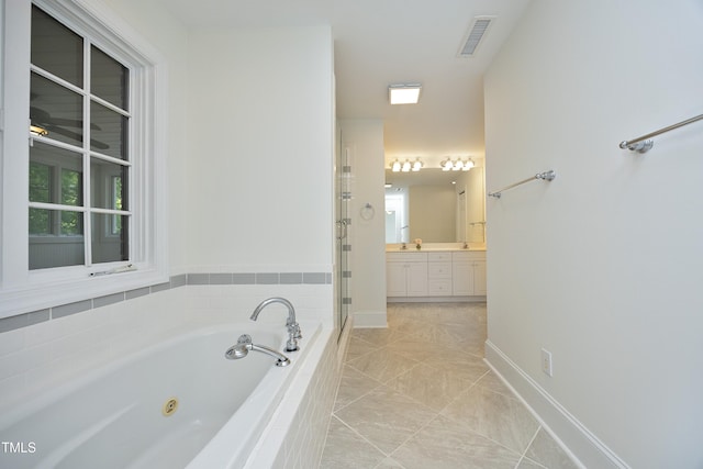 107 Silo Dr, Chapel Hill, NC 27514 - bathroom featuring a shower stall, a whirlpool tub, vanity, baseboards, and healthy amount of natural light