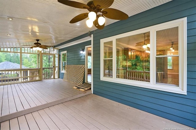 wooden terrace featuring ceiling fan