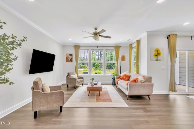 1156 Craigmeade Dr, Morrisville, NC 27560 - living room with plenty of natural light, ornamental molding, ceiling fan, recessed lighting, and wood finished floors