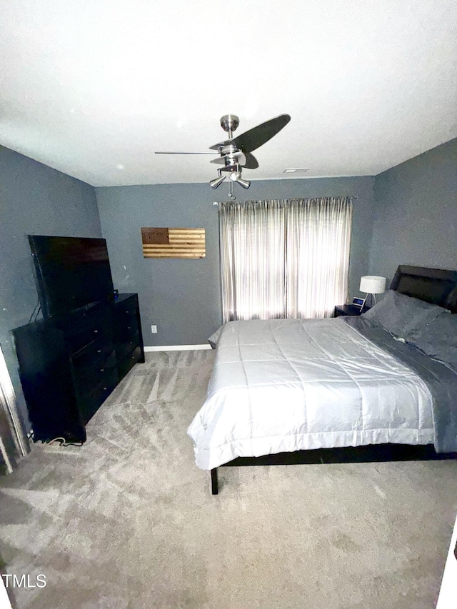 bedroom with carpet, baseboards, and ceiling fan