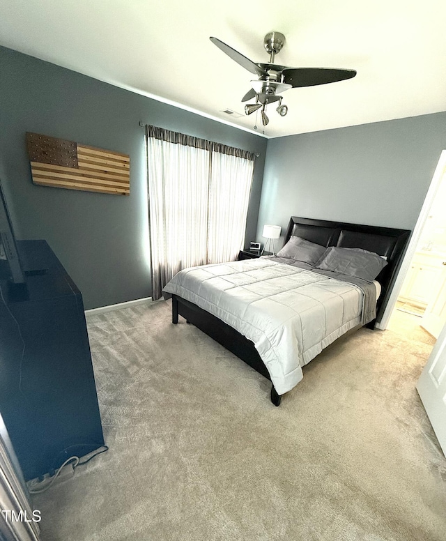 bedroom featuring carpet floors, a ceiling fan, and baseboards