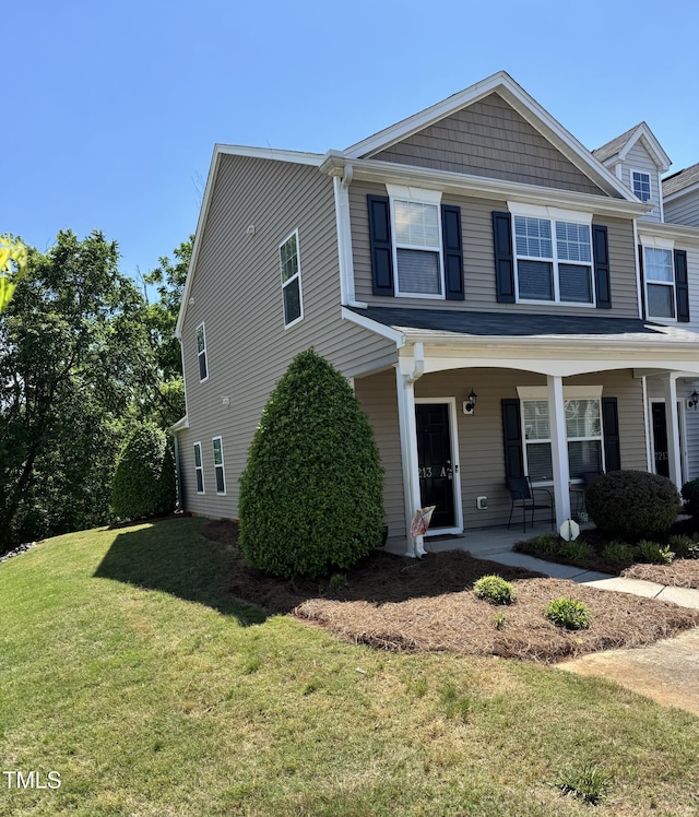 view of front facade with a front yard and a porch
