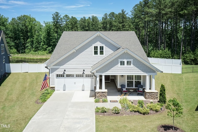 2501 Impulsion Dr, New Hill, NC 27562 - craftsman inspired home featuring a porch, an attached garage, concrete driveway, and a shingled roof